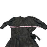 Karina Grimaldi  black and gold wrap dress Photo 2