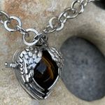Boutique Tigers Eye stone in a heart shaped necklace cage. 36”chain Photo 2