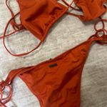 Triangl  bikini set bottoms size medium top size xl but fits a medium  Photo 1