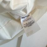 Reformation | Vivien Peplum Cotton Blend V-Neck Top in White Photo 7