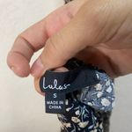 Lulu’s floral jumpsuit with slit sides size small Black Photo 4