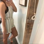 Everly  NWT medium cream ruffle bow detail romper Photo 1