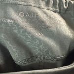 Athleta  Ultimate Stash Pocket High-Rise Workout Leggings green see flaw to butt Photo 4