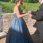 Rip In lace on the back, only worn once so I’m assuming it somehow happened when it was being stored in its dress bag. Dress from Glitterati Originally $550 Blue Size 6 Photo 0