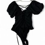 black bodysuit cap sleeves and open back with tie. size medium. Photo 1