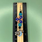 Blue and Light Orange Biohazard Symbol Earrings with Dangling Moon Charms Photo 3