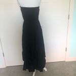 Hemline Black strapless dress with draped . Photo 34