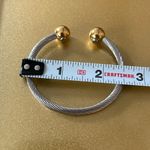 Silver Tone Twisted Bangle Bracelet w/ Gold Tone Ball Detail Photo 2