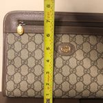 Gucci GG Supreme Clutch with Gold GG Zipper Pulls On Top Close and Front Pocket Photo 8
