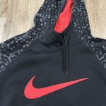 Nike Medium dri-fit women’s black and neon pink swearshirt.  Photo 1