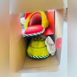 The grinch women’s slippers size 7/8 fits med size in the box Photo 2