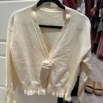 Cream Ruffle Hem Cardigan Sweater Photo 0