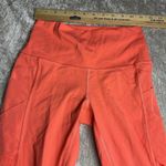 Lululemon  Rise and Flow Pant Mesh Criss Cross Size 4 Orange Coral EUC Photo 2
