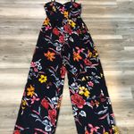 Band of Gypsies jumpsuit with built in pads size small, Ave blue floral, adjustable straps, smocked back, wide leg, pit to pit is 14, length from top to bottom is 48 Photo 4