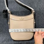Kate Spade NWT  Leila North South Crossbody taupe color peddled leather F9 Photo 3