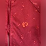 Pearl Izumi Red Cycling Jersey. Size Medium. With 3 pockets on back. Photo 1