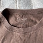 Brandy Melville  baby tee Photo 1