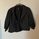 B. Wear  black striped puff sleeve blazer Photo 0
