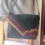 Stylish Green Suede Shoulder Bag with Purple and Gold Accents Photo 1