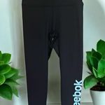 woman’s shiny black with Reebok on leg silver Leggings yoga workout Photo 1