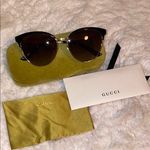 Gucci  Women's Black and Gold Sunglasses Authentic Photo 0