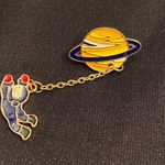 Junior Astronaut goes on their first spacewalk on this enamel pin/magnet. Blue Photo 5