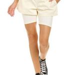We Wore What NWT Athleisure Layered Windbreaker Biker Shorts in Off White Photo 0