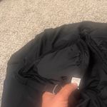 Elegant and timeless, this black swimsuit is perfect for any beach day. Enjoy a sleek and comfortable fit. Size XL Photo 7