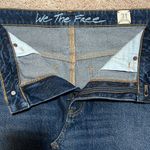 Free People We the Free Bailey blue denim mini skirt raw hem. Photo 1