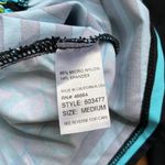 Title Nine  Rash Guard Side Scrunch Tie Black and Blue Two Sided Geometric Shapes Photo 4