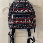 Disney  Park Loungefly Christmas mini backpack excellent condition see all photos Photo 0