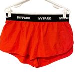 Ivy Park  Women's Medium Red Active Logo Taped Mesh Lined Woven Running Shorts Photo 1