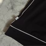 Lady Hagen  Sleeveless Black Polo Shirt with White Trim Photo 4