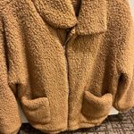Zaful Warm and stylish tan sherpa jacket with front pockets and zip closure. Photo 1