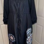 Lulumari  drawstring empire waist dress with embroidered floral appliqués. Photo 0