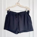 Lululemon • On The Fly Short *Woven *2.5" black drawstring pull-on travel Photo 1