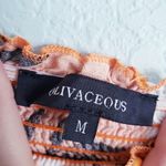 Olivaceous  Orange Floral Off Shoulder Smocked Romper Photo 3