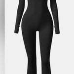 OQQ Woman’s yoga jumpsuit black ribbed bell bottoms Size Small Photo 0