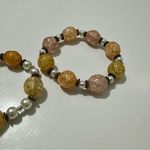 White and Orange Bracelets with Textured Beads Photo 1