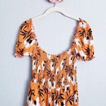 Olivaceous  Orange Floral Off Shoulder Smocked Romper Photo 4