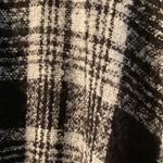 Me Too Black/White Ponco with fringe on edges and solid black cow neck. Photo 3