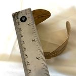 Gold tone feather cuff bracelet Photo 7