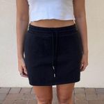 Black cotton mini skirt with elastic waist and tie Size M Photo 2