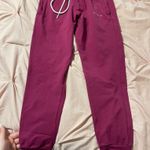 NVGTN joggers in the color berry. Only worn a handful of times! Photo 0