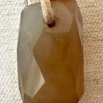 Agate pendant necklace on brown cord Photo 0