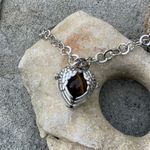 Boutique Tigers Eye stone in a heart shaped necklace cage. 36”chain Photo 9