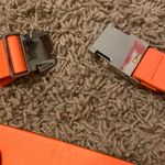 orange buckle belt Photo 1