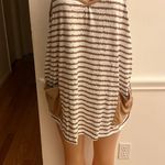 Lpkrt Stylish sleeveless dress with tan and white stripes. Features convenient pockets. Photo 1