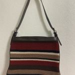 The Sak  soft knit multi colored striped crossbody purse.  Has a 70s/80s vibe Photo 1