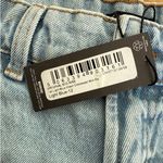 Pretty Little Thing - Tall Mid Rise Distressed Denim Shorts in Light Blue Wash Photo 1